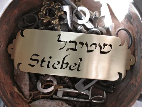 Metal plaque Stiebel - Brass 15x5