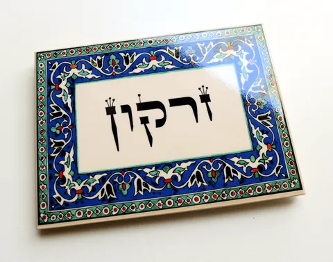Decorated ceramic sign